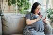 © MaaHoo Studio/Stocksy - Pregnant woman at home