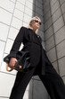 © Evil Pixels Photography/Stocksy - Blonde Girl In A Business Suit