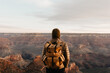 © Kristen Curette Photography LLC/Stocksy - A woman looking out towards the Grand Canyon