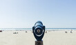 © Jeremy Pawlowski/Stocksy - Beach Viewfinder Telescope Looking Out Over Beach and Ocean