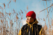 © Milles Studio/Stocksy - Serious ethnic guy standing in dry grass
