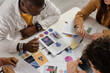 © Milles Studio/Stocksy - Crop designers examining color schemes