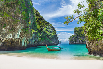 Wall Mural - Thai traditional wooden longtail boat and beautiful beach in Thailand.