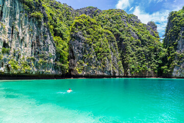 Wall Mural - Young man snorkel diving at Phi Phi island, Thailand.