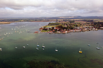 Wall Mural - A beautiful aerial view of the village of Bosham and the estuary with yachts at anchor.