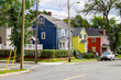Picturesque street view with historic New England style houses or cottages, flowers and parks in romantic fisher town in Sydney, Nova Scotia in Canada, a popular Indian Summer cruise destination