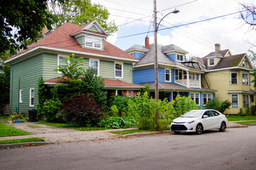 Picturesque street view with historic New England style houses or cottages, flowers and parks in romantic fisher town in Sydney, Nova Scotia in Canada, a popular Indian Summer cruise destination