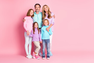 Poster - Full size photo of harmony idyllic big full family with mommy daddy three kids older younger siblings little boy girl hug embrace enjoy togetherness isolated over pink color background