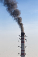 Environmental Damage: Air Pollution. The black smoke of the pipe.