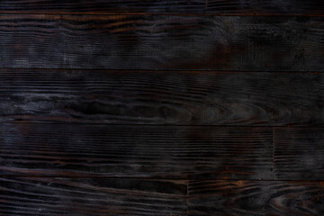 BBQ background. Burnt wooden Board texture. Burned scratched hardwood surface.