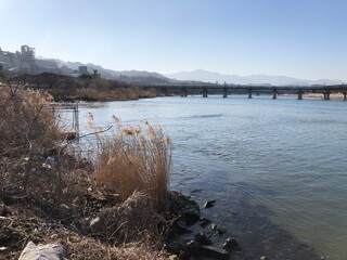 landscape from the edge of river with bridge