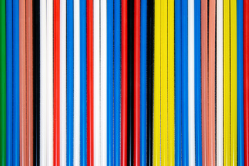 Wall Mural - top view of multi coloured  plastic  drinking straws in a row