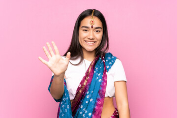 Wall Mural - Young Indian woman with sari over isolated background counting five with fingers