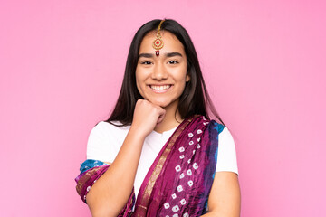 Wall Mural - Young Indian woman with sari over isolated background