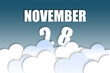 © SergeVo - november 28th. Day 28 of month,Month name and date floating in the air on beautiful blue sky background with fluffy clouds. autumn month, day of the year concept