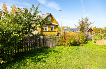 Wall Mural - Traditional rural wooden house in russian village in summer