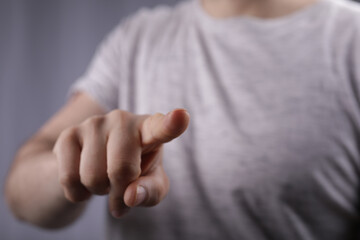 Poster - hand touch young man press