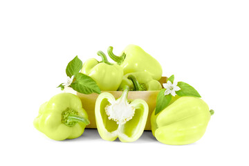 Fresh green sweet pepper with leaves and flowers isolated on a white background