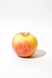 © SHIKHAR BHATTARAI/Stocksy - A single apple isolated against a white background.