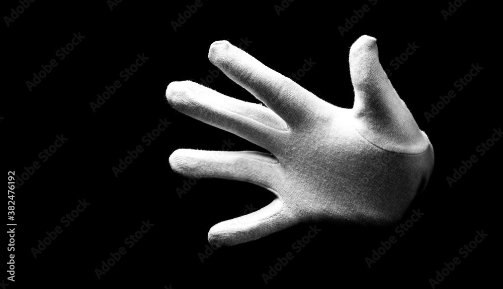Number five 5 - a male hand wearing white glove isolated on black ...