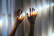 © Carolyn Lagattuta/Stocksy - Two hands reaching toward the light