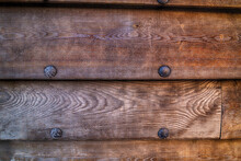 Side Of An Old Wooden Ship A Row Of Weathered Horizontal Boards With Iron Rivets