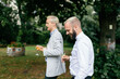 © VegterFoto/Stocksy - Friends at wedding reception