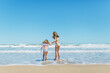 © MyMicrostock/Stocksy - Little Sisters Walking into the Sea
