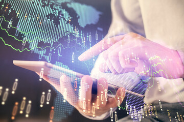 Aufkleber - Double exposure of man's hands holding and using a digital device and forex graph drawing. Financial market concept.