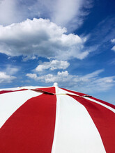 Red And White Umbrella Against Blue Sky