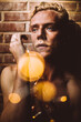 © Thais Varela/Stocksy - light bokeh, young man portrait