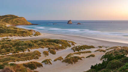 Long exposure sunset at Sandfly Bay beach, Dunedin, New Zealand