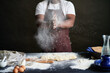 © Clique Images/Stocksy - Cook getting rid of extra flour