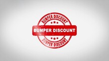 Bumper Discount Signed Stamping Text Wooden Stamp Animation. Red Ink On Clean White Paper Surface Background With Green Matte Background Included.