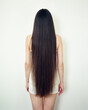 © Duet Postscriptum/Stocksy - Woman with long hair at white wall