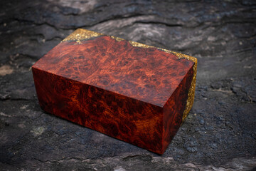 Wall Mural - Cube casting epoxy resin gold with nature burl BURMA PADAUK wood on the table