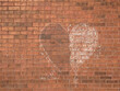 © Amanda Large/Stocksy - Chalk heart on a red brick wall