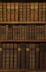 Wall Mural - antique books on old wooden shelf.