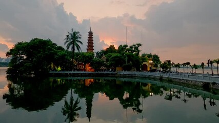 Wall Mural - Tran Quoc pagoda in sunset by time lapse. Ha Noi, Vietnam.