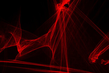 Abstract red lines drawn by light on a black background