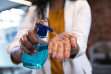 Close Up Of Woman Sanitizing Her Hands