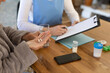 © Wavebreak Media - Mid section of senior woman talking pills at home