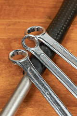 Wall Mural - three wrenches close-up lies on the handle of a hammer set mechanic tool