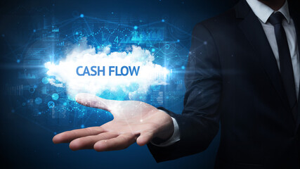 Hand of Businessman holding CASH FLOW inscription, successful business concept