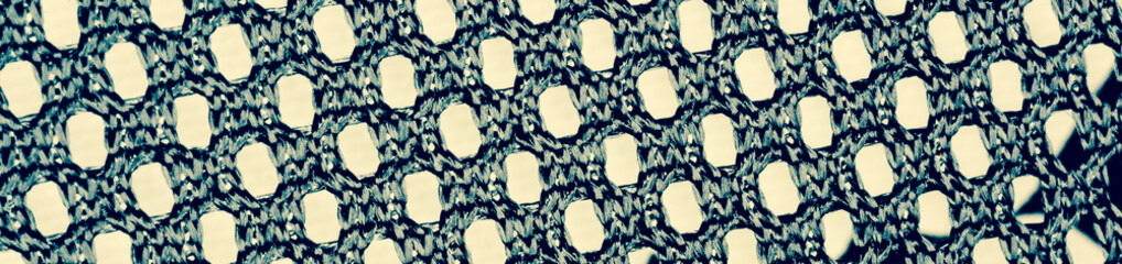 Handmade crochet cloth mesh pattern texture close up. Background fabric detail close up pattern.