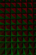 Abstract pyramid background in colored light. Foam material