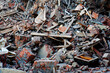 Pile of demolition rubble. Gray rubble at a building site. Concrete rubble debris on construction site