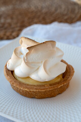 One piece of lemon tart with white eggs meringue