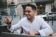 © BullRun - Happy smiling young man drink tea with lemon