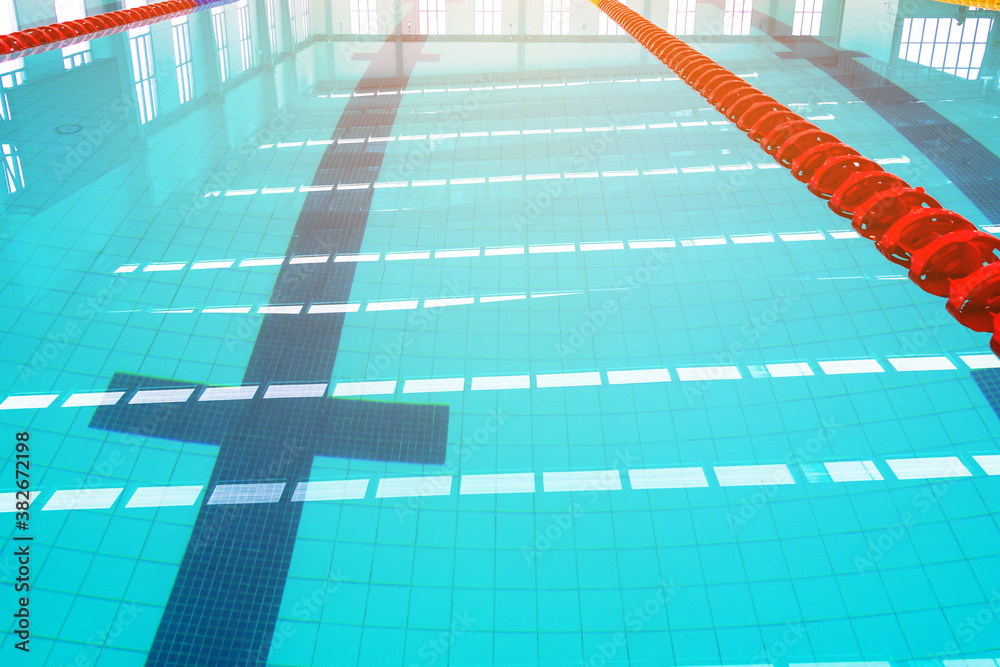 Track & lanes of a competition swimming pool..Indoor swimming pool with ...